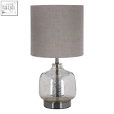 Lucia table lamp with a sleek mercury glass base and textured gray fabric shade, perfect modern table lamp