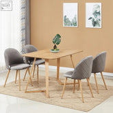 Modern dining set with lucia velvet dining chairs in grey featuring quilted backs and wood-effect metal legs