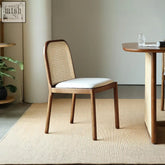 Minimalist lucile rattan dining chair in ash wood with woven cane back and white upholstered seat for dining use