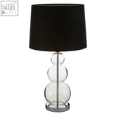 Clear glass table lamp with stacked spherical bulbs and a black fabric shade for stylish lighting