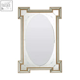 An elegant oval mirror with a gold-toned geometric frame and floral etchings in lulu antique finish rectangular style