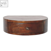 A sleek dark brown mango wood lunar drawer floating bedside table with one drawer and a round metallic knob