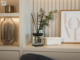 Luxury square diffuser sable with sleek transparent glass, clear liquid, and black lid and base for home fragrance