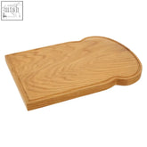 Light brown lyna bread shaped wooden serving board designed as a chopping and serving board resembling bread slice