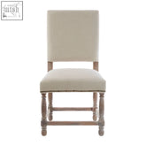 Beige linen dining chair with turned wooden legs and oak wood whitewash wood whitewash finish