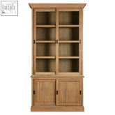 Light oak wood tall cabinet with glass-paneled upper doors and solid lower cabinets in washed grey finish