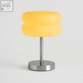Macaron glass table lamp with a soft yellow frosted glass shade and sleek chrome base perfect for modern decor