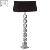 Silver geometric faceted table lamp with a black rectangular shade perfect for modern table lighting