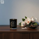 Black parks magnolia and bay leaf scented candle in a sleek glass jar with creamy magnolia and bay leaf notes