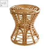 Light brown natural rattan maka stool with round base and pinched design features a woven circular top