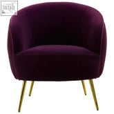 A plush manhattan purple velvet curved accent chair with sleek gold-tone metal legs for stylish comfort