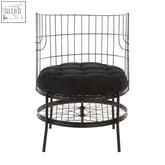 Black tufted cushion on mantis black wheel design chair with wireframe grid and lower circular shelf