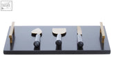 Marina black and gold cheese board with black marble surface and knife set featuring stainless steel blades and ergonomic grips