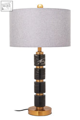 Elegant marmo grey fabric shade table lamp with stacked black marble and gold metal base segments