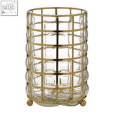Gold-toned medium hurricane lamp made of blown glass with grid pattern and rounded feet for stylish candle display