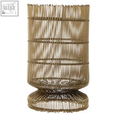 Golden-toned cylindrical woven wire candle holder with flared base and tiered bands for stylish candle display