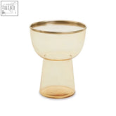 A martini amber glass side table featuring a translucent amber glass bowl with a polished gold rim and modern design