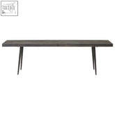 Dark gray oak wood bench with slender tapered metal legs perfect as a stylish wood bench for dining areas