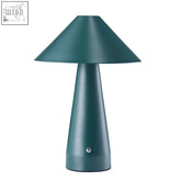 Teal forest green table lamp with a matte finish, metal shade, conical top, and tapered base for dimmable lighting