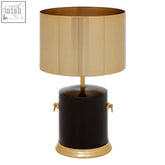 Melvin drum shade table lamp with gold finish, dark brown base, and decorative brass handles for stylish lighting