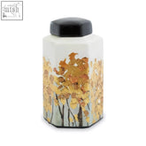 White ceramic jar with black lid and gold leaf autumn tree design in the mera small ceramic small ceramic jar