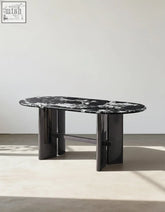 Meroy dining table with black and white marble oval top and sleek glossy black cylindrical legs perfect dining table