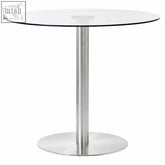 Modern round glass-top dining table with a sleek silver finish metropolitan round silver pedestal base