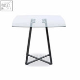 Modern square matte black dining table with clear glass top perfect for metropolitan style spaces
