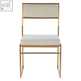 Gold-toned metal frame dining chair with milky white velvet upholstered seat and back for stylish dining