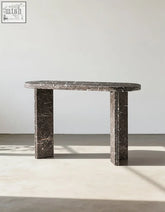 Midnight luxe console table featuring a dark gray black console table with natural marble surface and thick legs