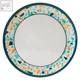 Mimo terrazzo dinner plate with white center and vibrant green orange teal black mosaic border on dark teal rim
