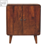 A mini classic chestnut wooden cabinet with two doors and rounded edges in a warm rich stain finish