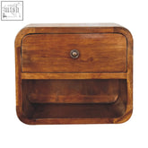 A warm chestnut solid mango wood mini curve floating bedside table with rounded corners and a single drawer