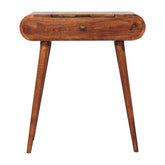 A warm brown wooden mini honey caramel dressing table with a foldable mirror and a single drawer with brass knob
