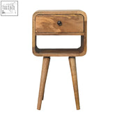 Mini oak-ish curve lower bedside table with soft curved edges made of natural mango wood and a single drawer