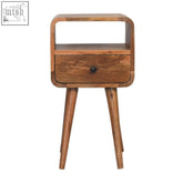 A mid-century modern mini oakish curve open bedside table with oak wood, single drawer, open slot, and tapered legs