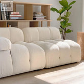 Cream-colored plush modular minita sofa with soft textured fabric and segmented cushioned sections for comfy seating