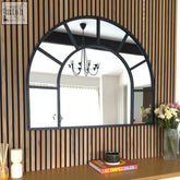 Black metal arched window mirror with segmented window design in sleek metal frame 95cm by 120cm