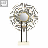 Mirano metallic finish quill sculpture with convex mirror, black spokes, gold rings, and white marble base stand