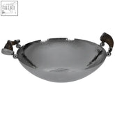 Silver hammered metal mixology haven bowl with black horn-style dark wooden handles and decorative spherical accents