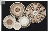 Set of five circular woven design wall art pieces in natural beige and black tones with black paper design patterns
