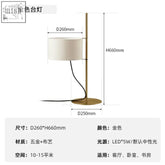 Modern floor lamp with wooden frame gold-toned base and white fabric shade for contemporary living room lighting
