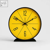 Bright yellow modern nordic wall clock with black numerals and hands in a sleek black frame wall clock