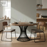 Modern round dining table with walnut parquet top and black metal curved pedestal base for stylish dining spaces