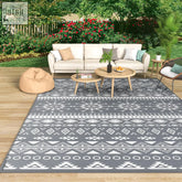 Gray and white geometric patterned mokani large outdoor rug made of waterproof plastic perfect for patio use