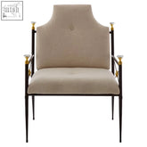 Beige upholstered monroe high back chair with black metal frame and gold-accented tapered legs from monroe range