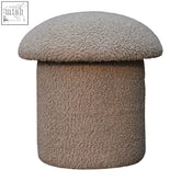 A cozy beige mushroom footstool with rounded top and cylindrical base in soft mud boucle fabric