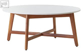 Minimalist round marble coffee table with smooth white marble top and warm acacia wood legs with x-shaped support