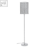 Silver mesh cylindrical lampshade on slender chrome myles floor lamp perfect for modern living spaces