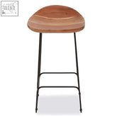 A nandri acacia wood bar stool with a rounded seat and black frame bar legs perfect for any space